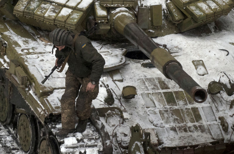 A Ukrainian serviceman stands on a tank in Avdiivka, eastern Ukraine, Thursday, Feb. 2, 2017. Two Ukrainian soldiers have been killed in the countryâs industrial east as both government forces and rebels reported shelling on their positions overnight, Ukraineâs government said early Thursday. (AP Photo/Evgeniy Maloletka)